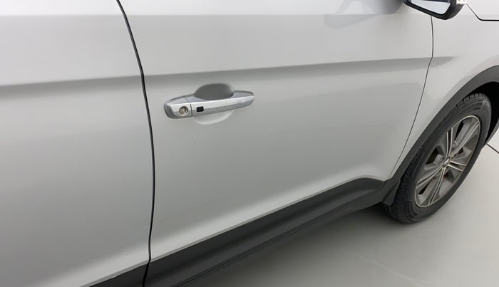 2016 Hyundai Creta SX PLUS AT 1.6 PETROL, Petrol, Automatic, 1,01,064 km, Driver-side door - Minor scratches